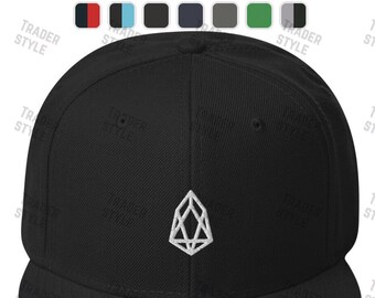 May include: Black and white embroidered logo of a geometric shape on a black fitted baseball cap.