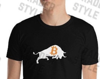 May include: A black t-shirt with a white bull graphic. The bull has a bitcoin symbol on its back.