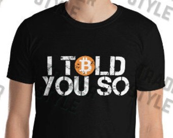 May include: Black t-shirt with a white graphic that says "I told you so" with a Bitcoin symbol in the middle of the word "told".