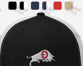 May include: A black and white trucker hat with a white mesh back. The front of the hat features an embroidered white bull with a red letter 'D' on its side.