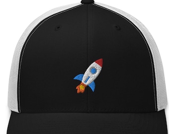 May include: A black and white trucker hat with a red, white, and blue rocket ship embroidered on the front.
