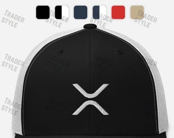 May include: A black and white trucker hat with a white 'X' logo on the front. The hat has a black mesh back and a white front panel.