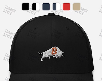 May include: Black mesh trucker hat with a white embroidered bull with a Bitcoin symbol on its back. The bull is facing the right side of the hat.