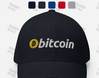 May include: A navy blue baseball cap with a white embroidered "bitcoin" logo and a yellow bitcoin symbol.