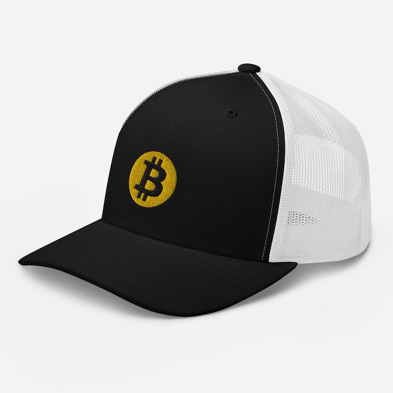 May include: Black and white trucker hat with a yellow embroidered Bitcoin symbol.