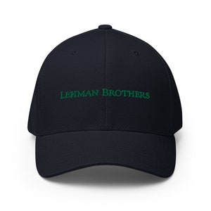 May include: A navy blue baseball cap with the text "LEHMAN BROTHERS" embroidered in green.