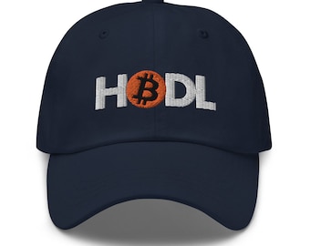 May include: A navy blue baseball cap with white embroidered text that reads "HODL" with a bitcoin symbol in the middle of the text.