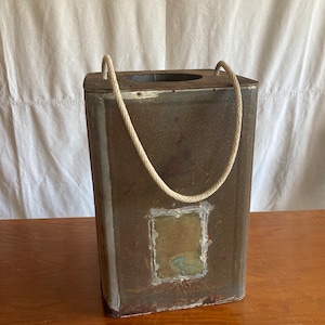 Vintage cricket box metal with a wooden top