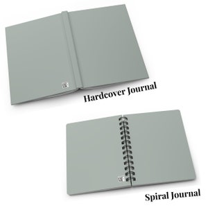 May include: Two journals, one with a hardcover and one with a spiral binding. Both are a light gray color and have a small QR code on the cover. The hardcover journal has the text "Hardcover Journal" below it, and the spiral journal has the text "Spiral Journal" below it.