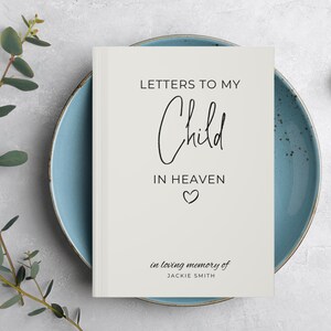 May include: A white book with the title "Letters to My Child in Heaven" and the text "in loving memory of JACKIE SMITH".
