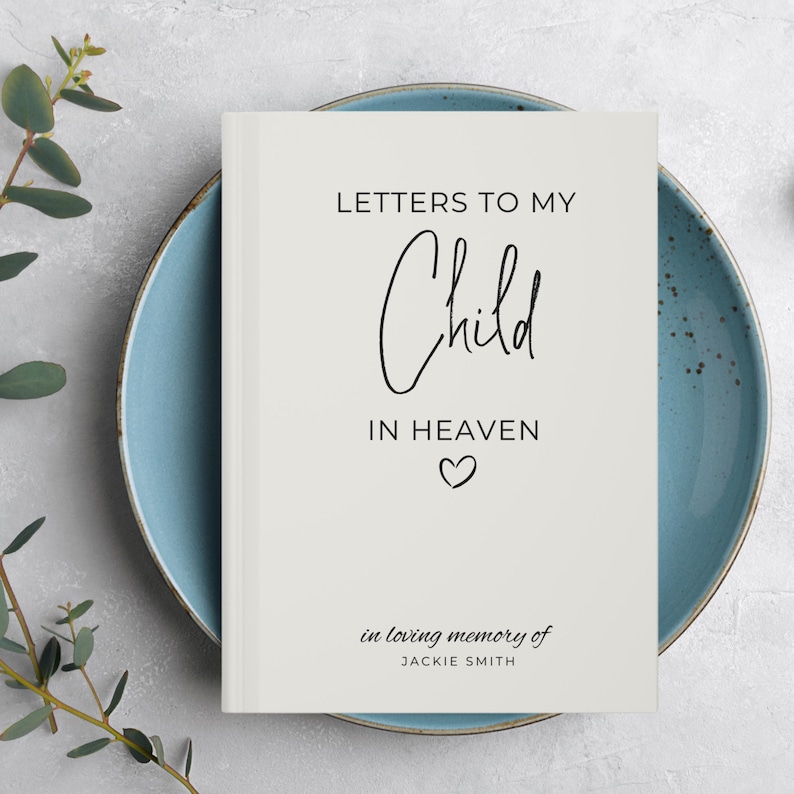 May include: A white book with the title "Letters to My Child in Heaven" and the text "in loving memory of JACKIE SMITH".