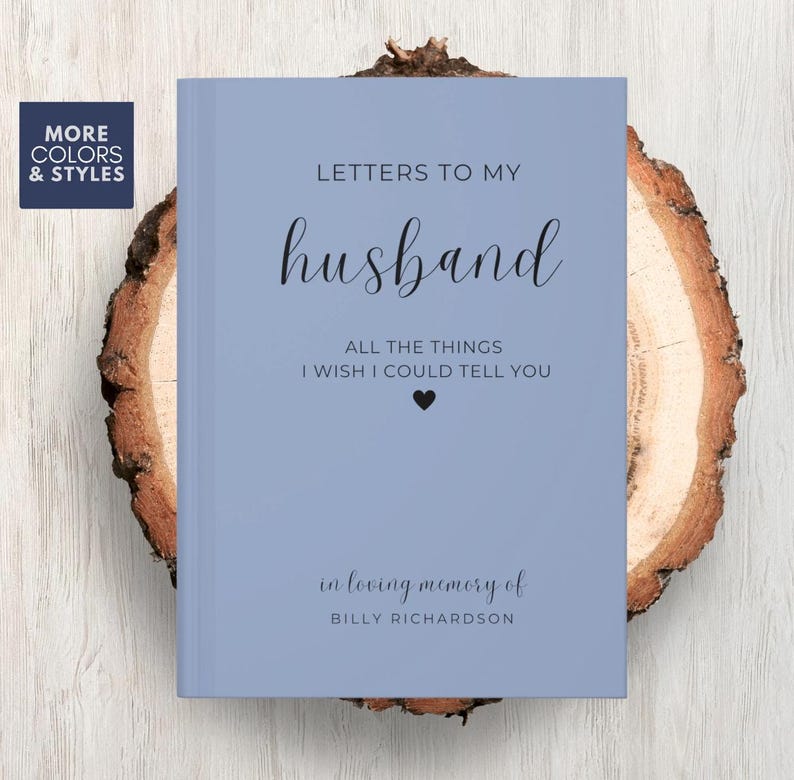 May include: A light blue journal with the text "Letters to my husband" and "All the things I wish I could tell you" in black text. The journal also has the text "in loving memory of Billy Richardson" in black text.