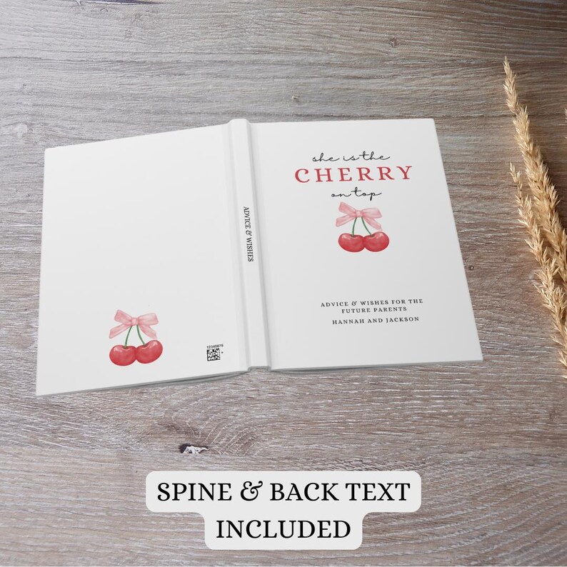 May include: A white book with a pink and red cherry illustration on the front cover. The title of the book is "She is the Cherry on Top". The back cover has the text "Advice & Wishes for the Future Parents Hannah and Jackson".