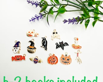 May include: A collection of 12 Halloween-themed charms, including pumpkins, bats, a ghost, a witch's hat, a skull and crossbones, a candy corn, a candle, a crow, and a cat. The charms are gold-coloured with orange, black, and white enamel.  h-2 hooks included.
