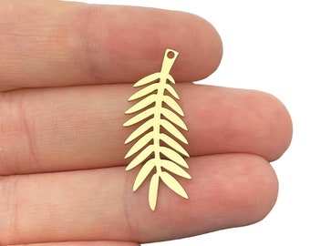 May include: Gold-colored metal leaf charm with a hole at the top for attaching to jewelry or other crafts.