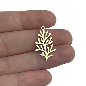 May include: Gold-colored metal charm shaped like a tree branch with a loop at the top for attaching to jewelry or other crafts.