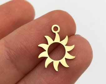 May include: Gold-colored metal sun charm with a loop for attaching to jewelry or other crafts.