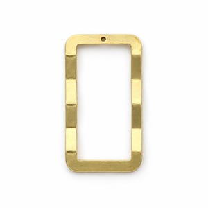 May include: A gold-coloured metal rectangular pendant with a hollow centre and rounded corners. The frame features a subtle hammered, wavy texture along the vertical sides and includes a single small circular hole at the top for attachment.