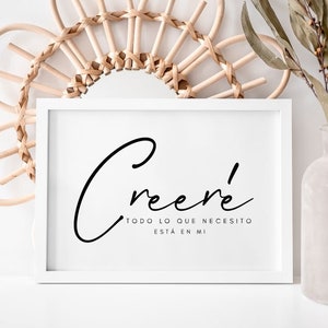 May include: White framed print with black text that reads "Creer' todo lo que necesito est&aacute; en mi" which translates to "Believe everything I need is in me".