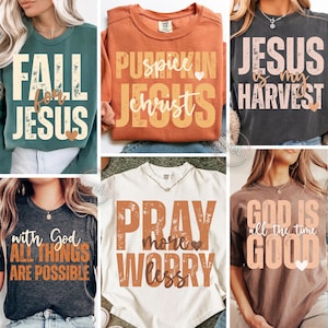 May include: Collection of six t-shirts with inspirational messages. The shirts are in various colors, including green, orange, gray, and white. Each shirt features a different phrase in a bold, stylized font, such as "Fall for Jesus" and "Pray more, worry less."