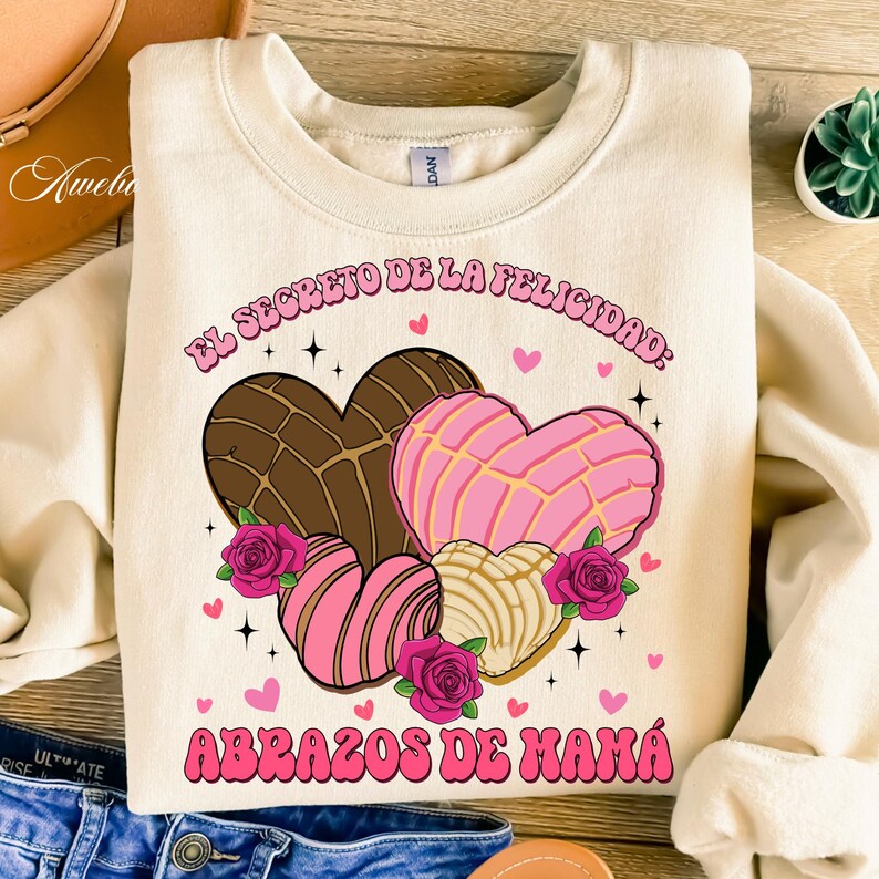 Celebrate the love of a mamita linda with this sweet and colorful Mama Latina PNG Bundle. Featuring pan dulce, conchas, hearts, rosas, and heartfelt Spanish phrases, this collection is perfect for Mothers Day gifts, mugs, shirts, tote bags, and more!

Each PNG design is high resolution with a transparent background—ready for sublimation or print projects. Just download and create something beautiful for mama.