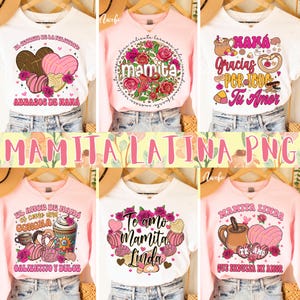 Op de afbeelding: Collectie witte en roze t-shirts en sweatshirts met Spaanse tekst en afbeeldingen. Ontwerpen omvatten bloemstukken, harten en concha-gebak. De tekst bevat zinnen als "Mamita Linda" en "Te amo".