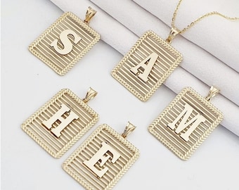 May include: Five gold-tone pendants with a rectangular shape and a woven design. Each pendant features a different letter of the alphabet: S, A, H, E, and M.