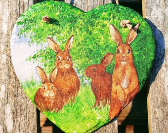 Easter bunnies families on a slate wall hanging