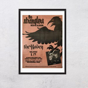 May include: Framed poster featuring a black raven illustration with red eyes, and the text "the stranglers NEW ALBUM" in a stylized font. The album title "five Raven" is also displayed, along with tour dates and the single "Duchess".