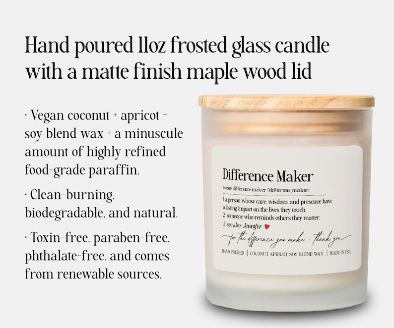 May include: A hand-poured frosted glass candle with a matte finish maple wood lid. The candle has a label that reads "Difference Maker" and includes a definition. The candle is made with vegan coconut, apricot, and soy blend wax.