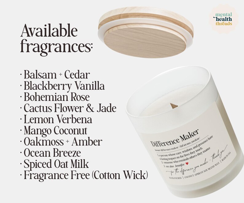 May include: A white glass candle with a wooden lid, labeled "Difference Maker." The candle's available fragrances are listed, including Balsam + Cedar, Blackberry Vanilla, and Mango Coconut. The candle has a cotton wick.