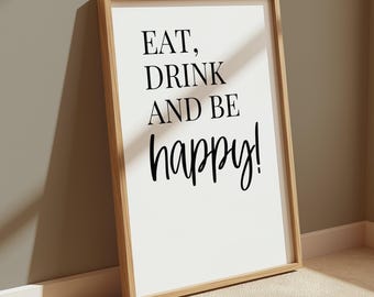 Peut inclure: Une affiche murale rectangulaire dans un cadre en bois clair avec un fond blanc et le texte noir EAT, DRINK AND BE happy! Le design utilise une combinaison de lettres serif en gras pour les trois premiers mots et une police manuscrite.