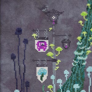 May include: Cross-stitch design featuring a whimsical scene with stylized mushrooms, a street lamp with purple and blue lanterns, and a tree. The color palette includes shades of purple, blue, green, and white, creating a fantasy theme.