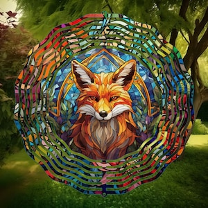 May include: A colourful metal wind spinner featuring a stained glass style fox design. The fox has orange, brown, yellow, and blue colours. The wind spinner has a circular shape with multiple layers of metal.