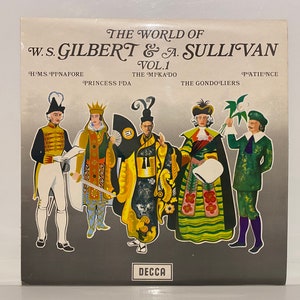 May include: A silver record album cover with the title 