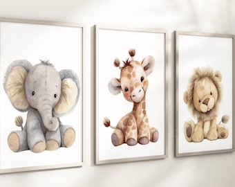 May include: Three framed prints featuring watercolour illustrations of a grey elephant, a brown giraffe, and a brown lion. Each animal is depicted in a playful, cartoon style.
