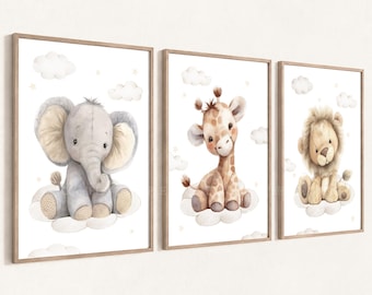 May include: A set of three framed wall art prints featuring watercolor illustrations of a grey elephant, a brown and tan giraffe, and a light brown lion, each sitting on white clouds against a white background with small stars.