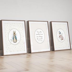 May include: Three framed prints with illustrations of Peter Rabbit and a duck, plus an inspirational quote. The prints have a neutral colour palette with brown frames, ideal for nursery or children's room decor.