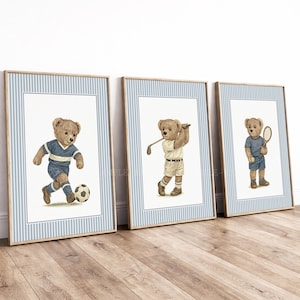 May include: Three framed wall art prints featuring brown teddy bears engaged in sports. The first bear plays football in a blue uniform, the second plays golf in a white outfit, and the third holds a tennis racket while wearing a blue shirt and shorts.