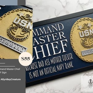 May include: A framed navy blue sign with white text that reads "COMMAND MASTER CHIEF" and "BECAUSE BAD ASS MOTHER FUCKER IS NOT AN OFFICIAL NAVY RANK." The sign includes a gold-colored emblem with the letters "USN" and the word "COMMAND."