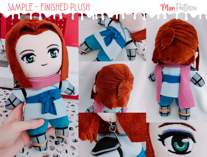 May include: A plush toy with brown hair, a blue and white outfit, and a pink scarf. The toy is wearing a blue bow around its waist. The toy is sitting on a table with a red and white pattern.
