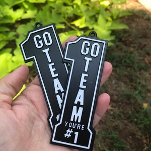 Go Team Homecoming Trinket!