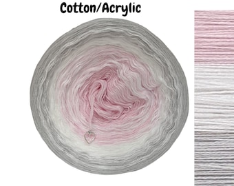 May include: A skein of ombre yarn in shades of pink, white, and gray. The yarn is made of cotton and acrylic and is labeled "Cotton/Acrylic".