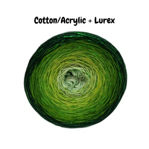 May include: A skein of green yarn with a metallic sheen. The yarn is made of cotton and acrylic with Lurex.