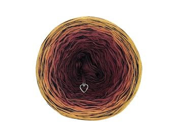 May include: A ball of yarn with a gradient of orange, red, and brown colors. A small silver heart charm is attached to the yarn.