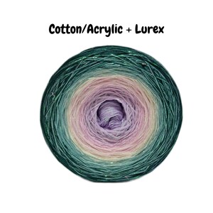 May include: A skein of yarn in a gradient of green, pink, and purple with a subtle shimmer. The yarn is labeled "Cotton/Acrylic + Lurex".