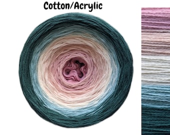 May include: A ball of yarn with a gradient of pink, cream, blue, and green colors. The yarn is labeled "Cotton/Acrylic".