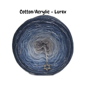 May include: A skein of blue ombre yarn with silver lurex thread. The yarn is wound into a ball shape and has a silver star charm attached.