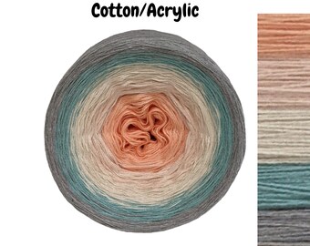 May include: A ball of ombre yarn in shades of peach, beige, teal, and gray. The yarn is labeled "Cotton/Acrylic".