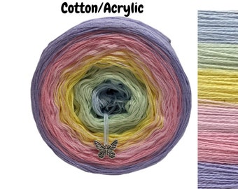 May include: A ball of yarn with a rainbow ombre colour pattern in shades of purple, pink, yellow, green, and blue. The yarn is labelled "Cotton/Acrylic".